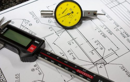 Caliper and clock for on-plane machining to measure dimensions